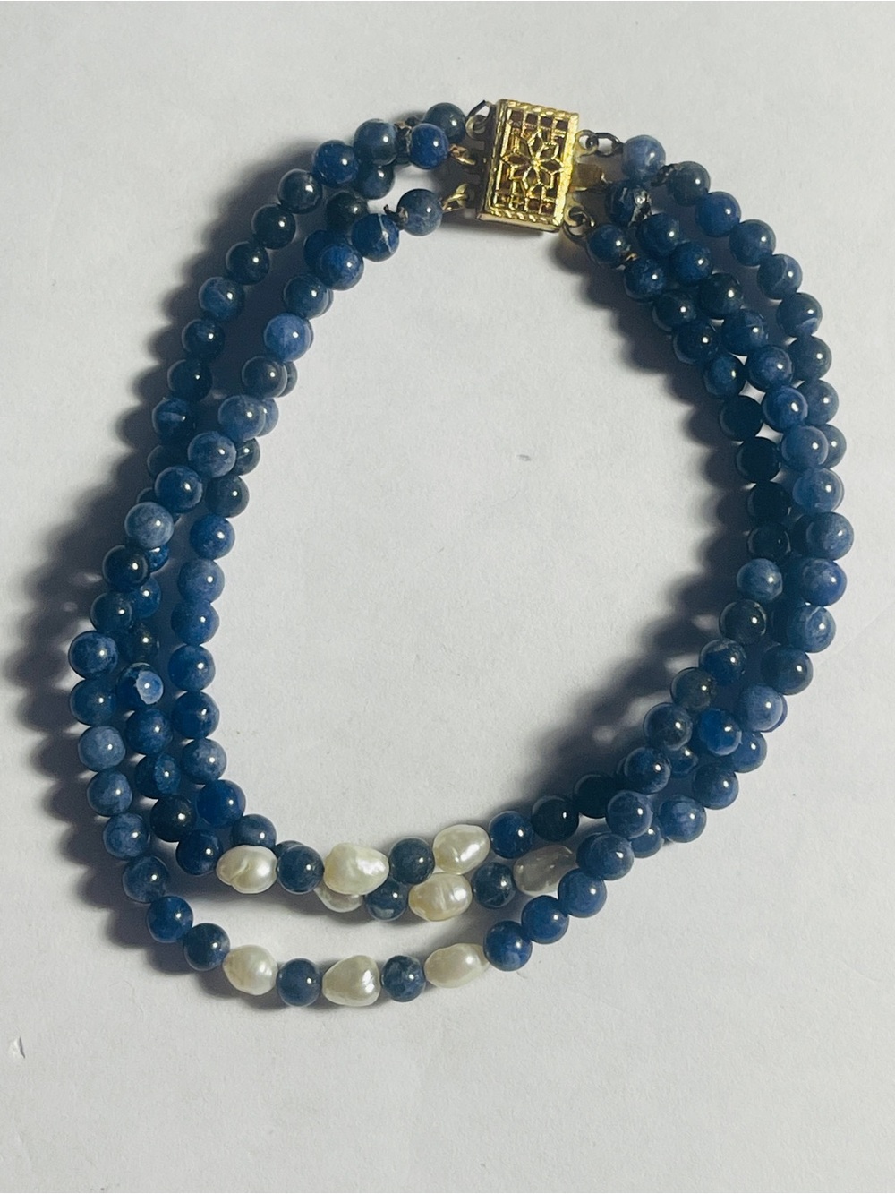 Three-Strand Blue Beaded Bracelet with White Pearl Accents